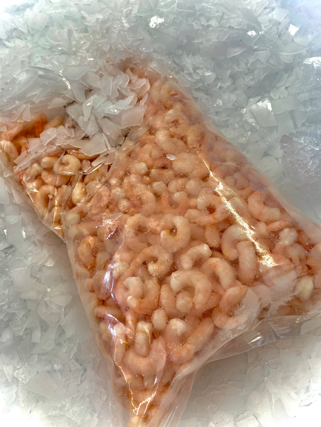 Cocktail prawns by Marisco Fish! Cornwall's finest seafood. Packed in a plastic bag on top of fresh ice.